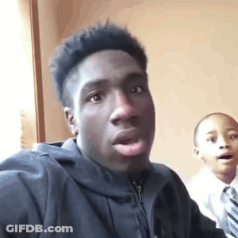 Young Man In Black Jacket Taking Selfie GIF