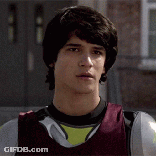 Young Man In Black Shirt And Red Vest GIF