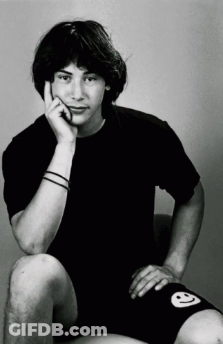 Young Man In Black Shirt And Shorts With Smiley Face GIF