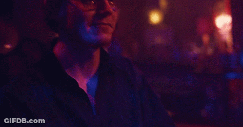 Young Man In Black Shirt And Silver Studded Belt GIF
