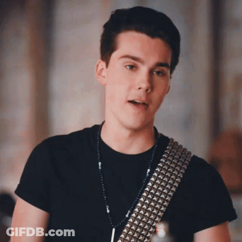 Young Man In Black Shirt And Silver Studded Belt GIF