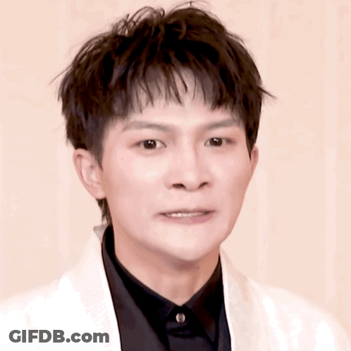 Young Man In Black Shirt And White Jacket GIF