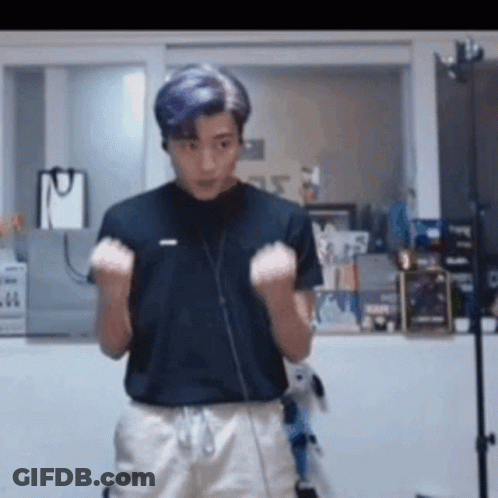 Young Man In Black Shirt And White Shorts Raising Hands GIF
