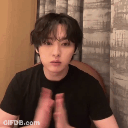 Young Man In Black Shirt Clapping Hands GIF