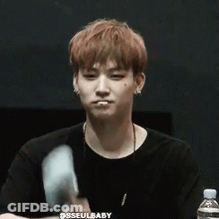 Young Man In Black Shirt Holding Cotton Candy GIF