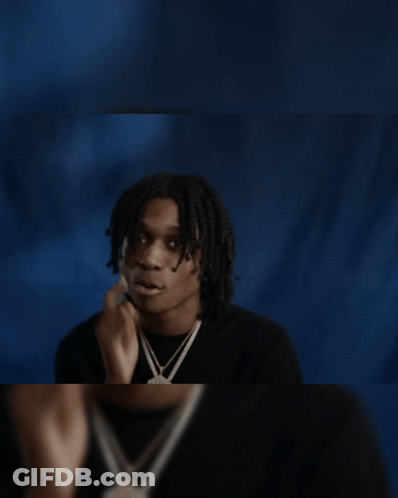 Young Man In Black Shirt Looking In Mirror GIF
