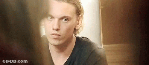 Young Man In Black Shirt Looking In Mirror GIF