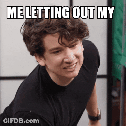 Young Man In Black Shirt Making Funny Face GIF