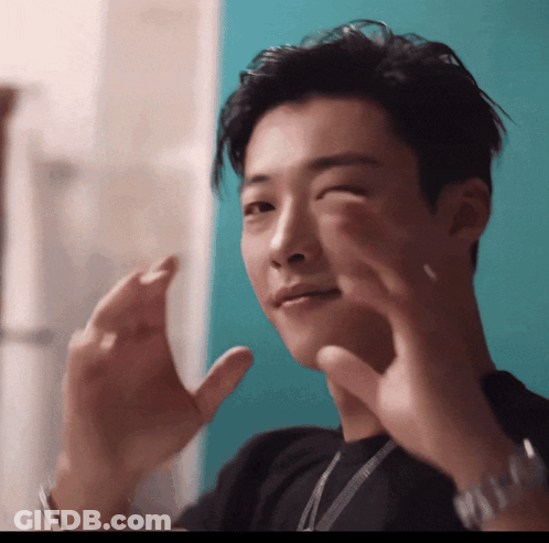 Young Man In Black Shirt Making Funny Face GIF