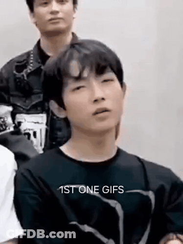 Young Man In Black Shirt Making Funny Face GIF