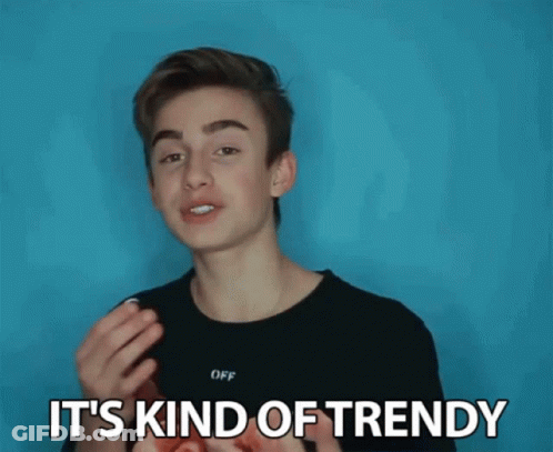 Young Man In Black Shirt Saying It's Kind Of Trendy GIF