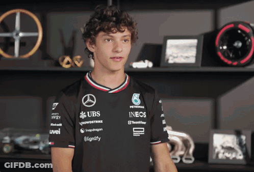 Young Man In Black Shirt Saying UBS GIF