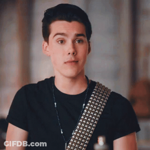 Young Man In Black Shirt With Studded Guitar Strap GIF