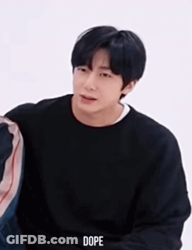 Young Man In Black Sweater Sitting GIF