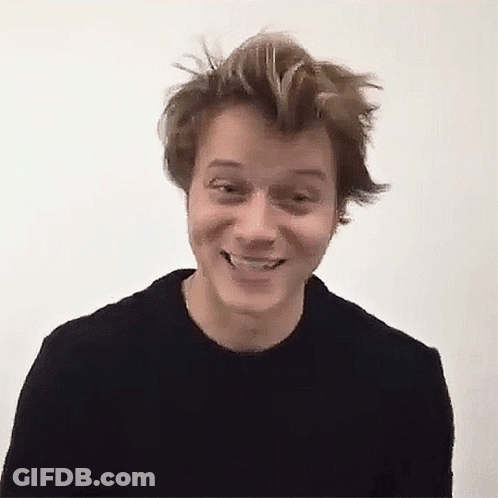 Young Man In Black Sweater Smiling GIF