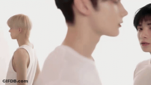 Young Man In Black Sweater With Chinese Characters GIF