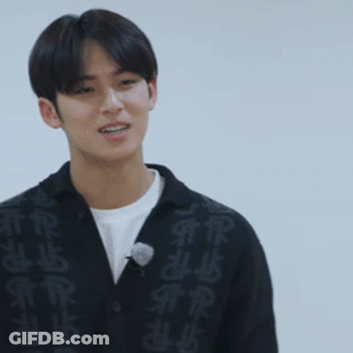 Young Man In Black Sweater With Chinese Characters GIF