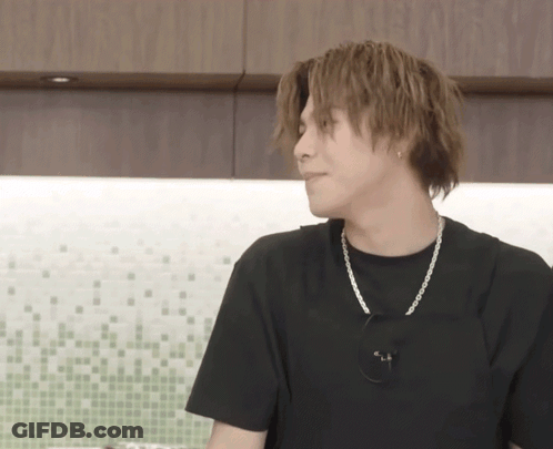 Young Man In Black T-Shirt And Silver Chain GIF