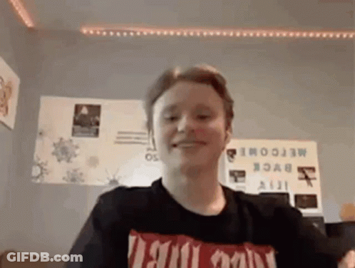 Young Man In Black T-Shirt Smiling GIF