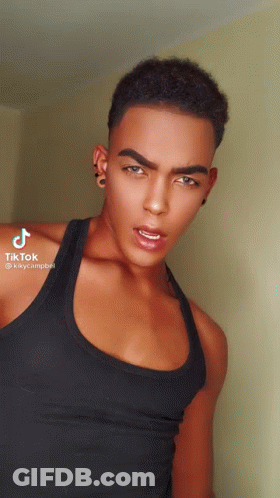 Young Man In Black Tank Top And Earrings GIF