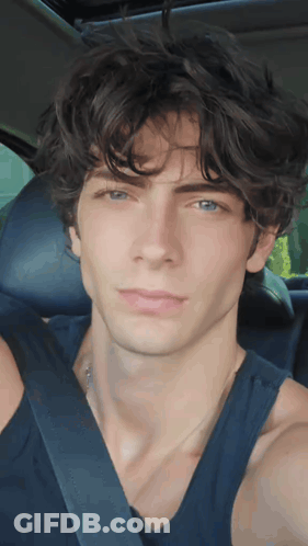 Young Man In Black Tank Top And Seat Belt GIF