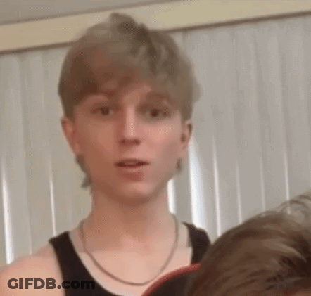 Young Man In Black Tank Top With Chain GIF