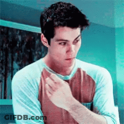 Young Man In Blue And Brown Shirt GIF