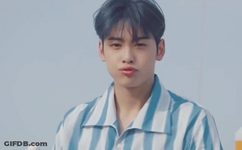 Young Man In Blue And White Striped Shirt With Bubbles GIF