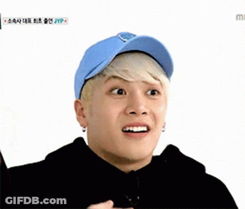Young Man In Blue Hat And Black Hoodie GIF