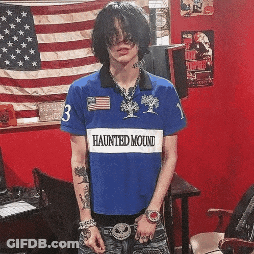 Young Man In Blue Haunted Mound Shirt GIF