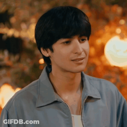 Young Man In Blue Jacket And Earrings GIF