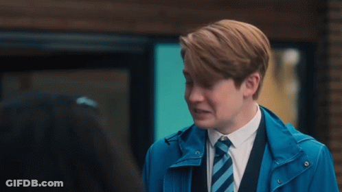 Young Man In Blue Jacket And Tie Talking GIF
