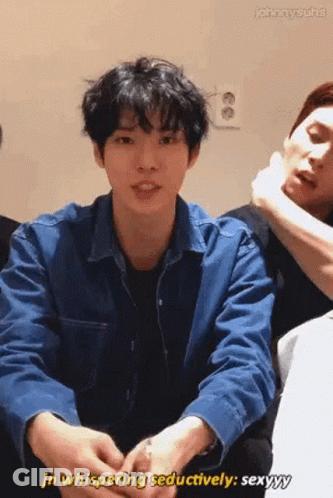 Young Man In Blue Jacket Sitting Next To Man GIF