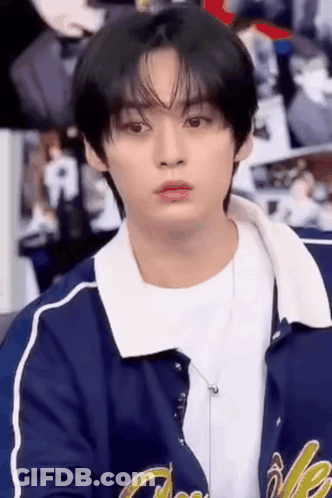 Young Man In Blue Jacket Sitting GIF