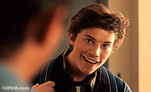 Young Man In Blue Jacket Smiling At Another Man GIF