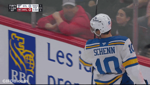 Young Man In Blue Jacket With Hands In Air GIF
