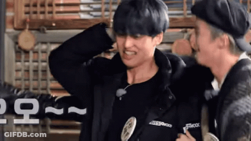 Young Man In Blue Shirt And Black Hat Making Funny Face GIF