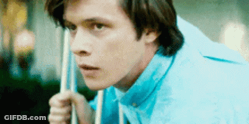Young Man In Blue Shirt Holding Pool Cue GIF