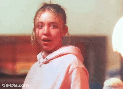 Young Man In Blue Shirt Looking Out Window GIF
