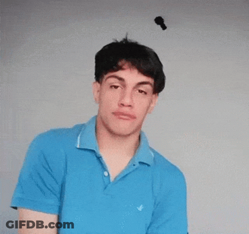 Young Man In Blue Shirt Making Funny Face GIF