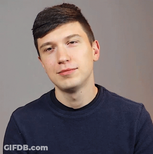 Young Man In Blue Shirt Shushing GIF