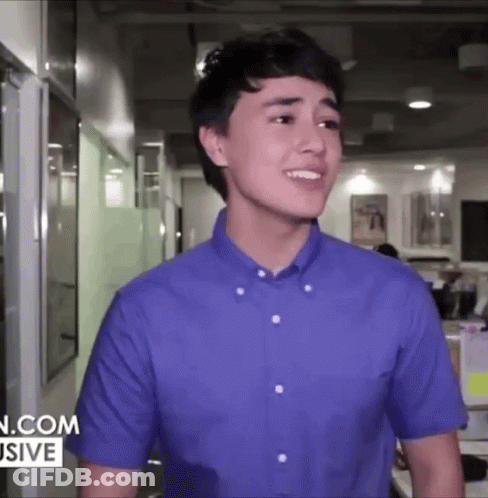 Young Man In Blue Shirt Smiling GIF