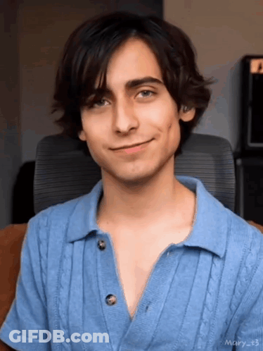 Young Man In Blue Shirt Smiling GIF