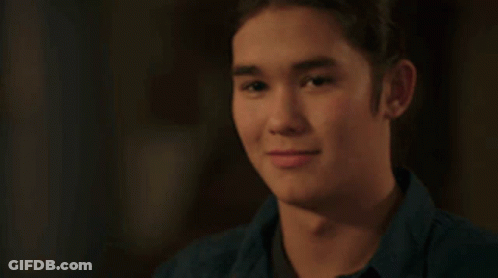 Young Man In Blue Shirt Smiling GIF