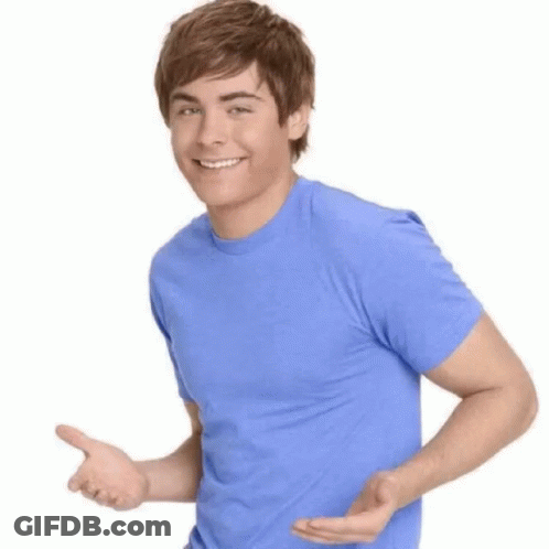 Young Man In Blue Shirt Smiling And Pointing GIF