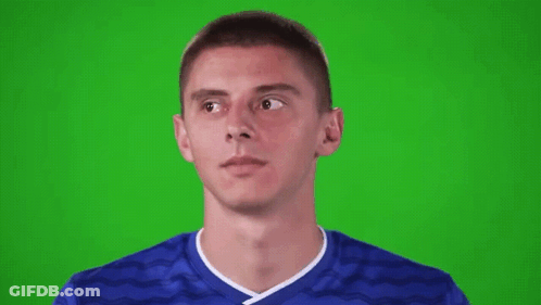 Young Man In Blue Soccer Jersey Looking Up On Green Screen GIF
