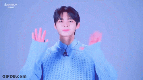 Young Man In Blue Sweater Making Funny Face GIF