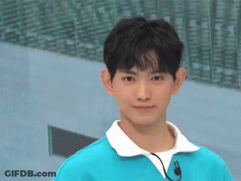 Young Man In Blue Sweater With Microphone GIF