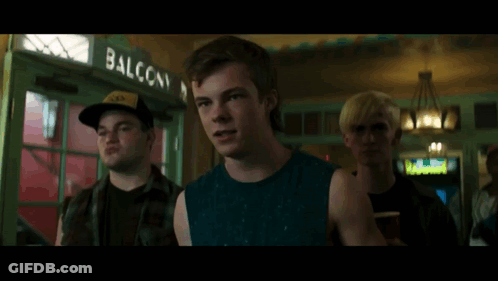 Young Man In Blue Tank Top Making Funny Face GIF