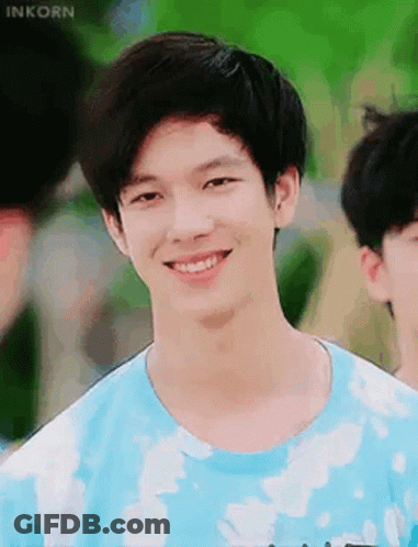 Young Man In Blue Tie-Dye T-Shirt Smiling GIF